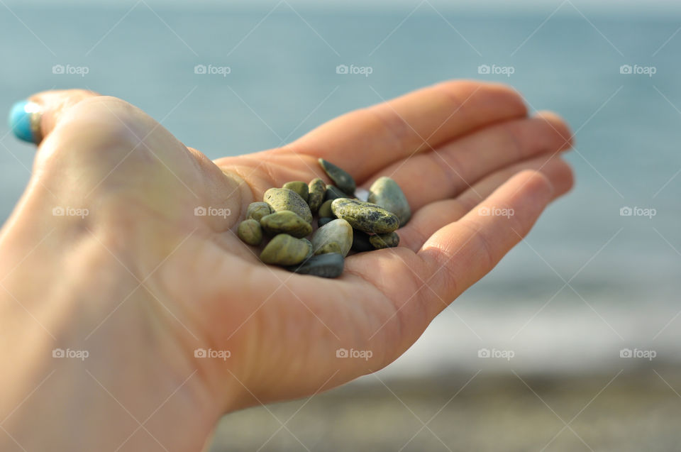 Small stones in a hand