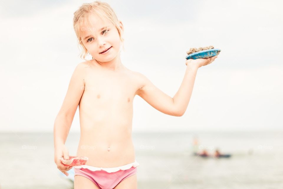 Girl playing on the beach