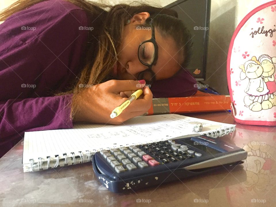 Teenage girl fell asleep while studying