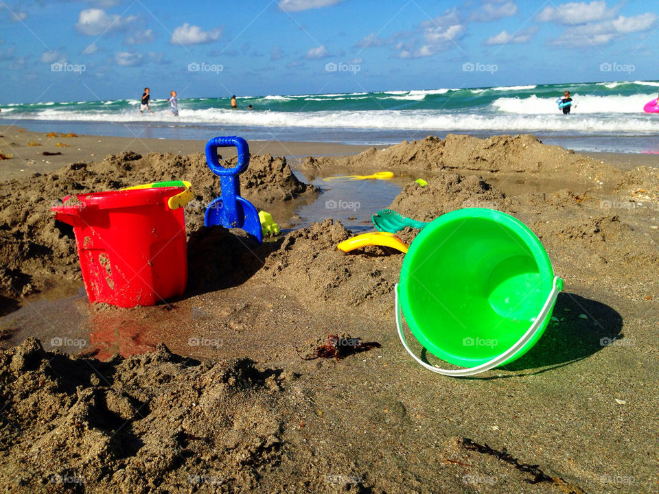 Buckets and shovel in sand at beach, Hollywood Beach, Florida