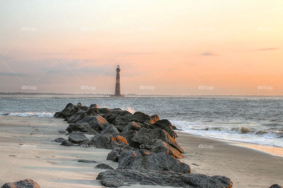 Distant view of lighthouse on beach