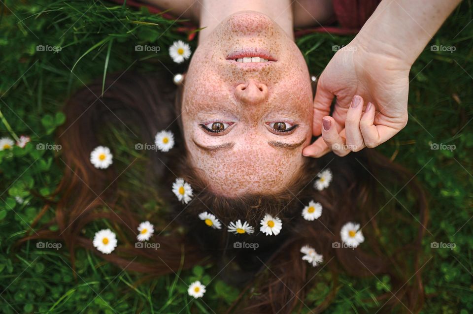 pretty girl relaxing outdoor, having fun, holding plant, happy young lady and spring green nature, harmony concept