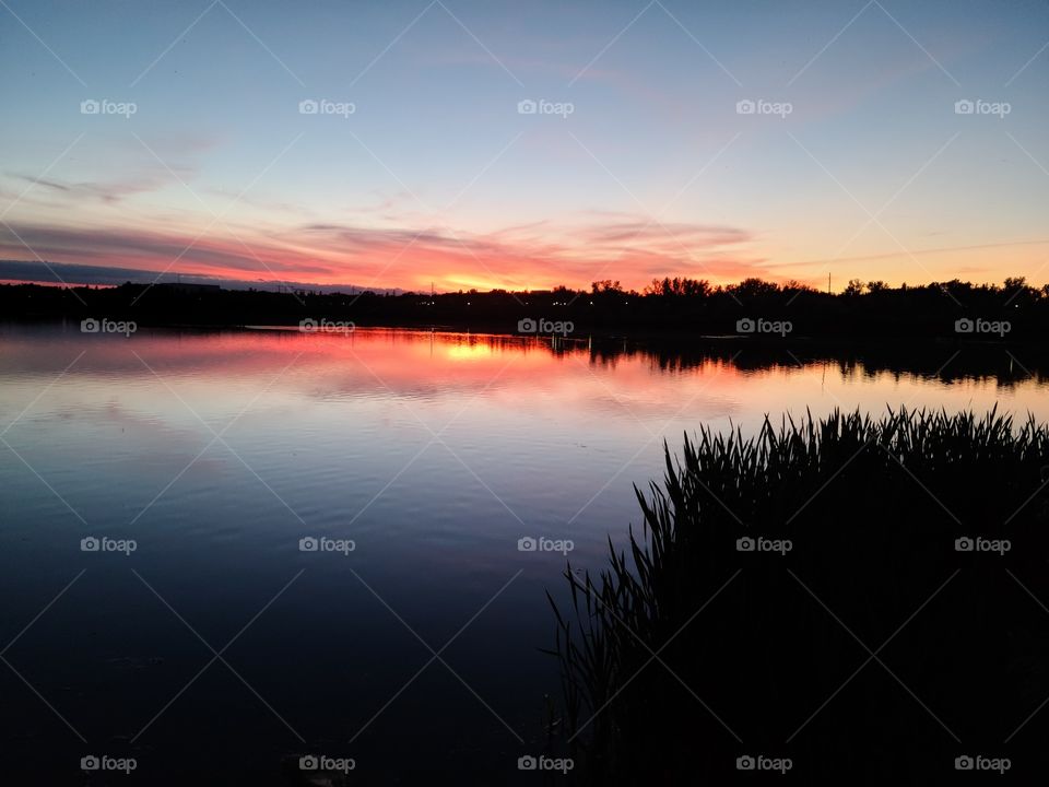 A sunset over Wascana Lake in Regina, Saskatchewan