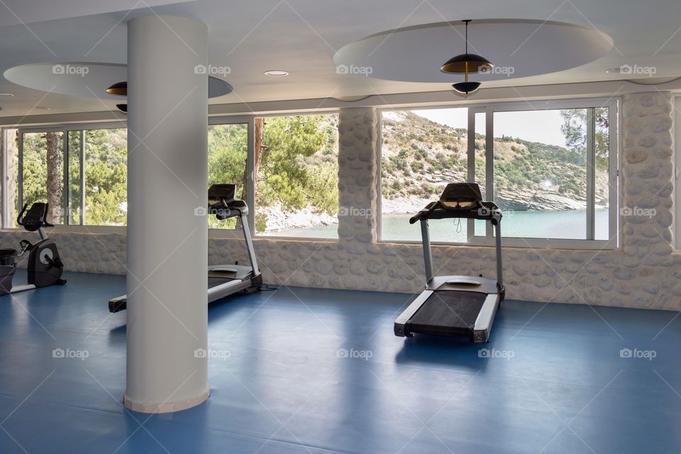 Modern fitness gym interior in sea resort in Greece