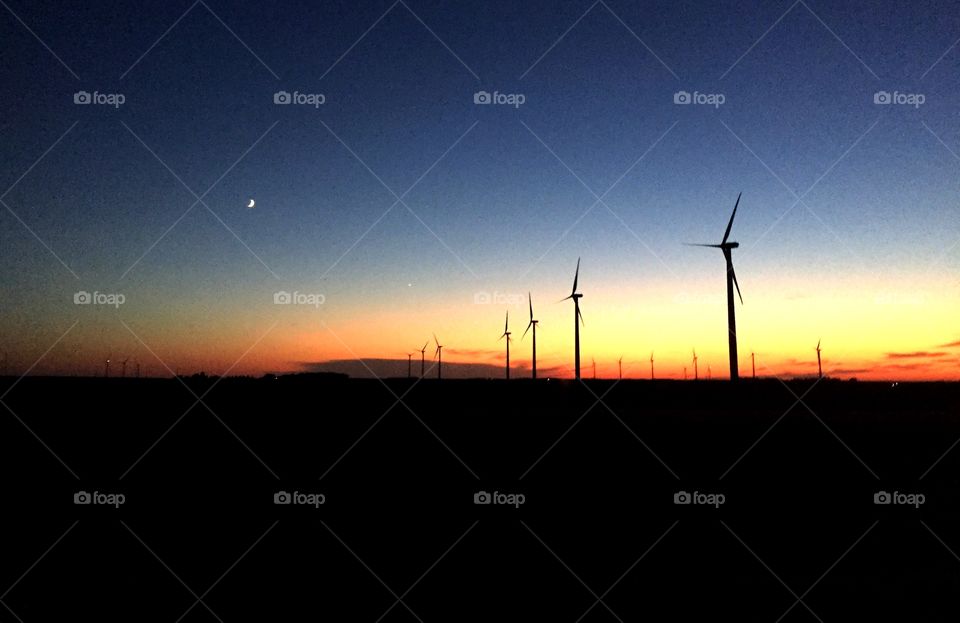 Beautiful Renewable Energy. I was driving from Ohio to Minnesota and happened to catch sunset in the wind fields of Iowa.