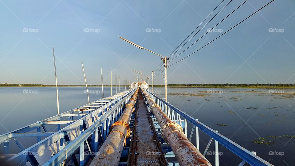 Pipe bridge spanning the water