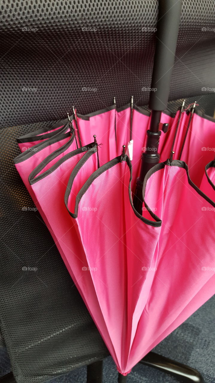 Closed pink umbrella