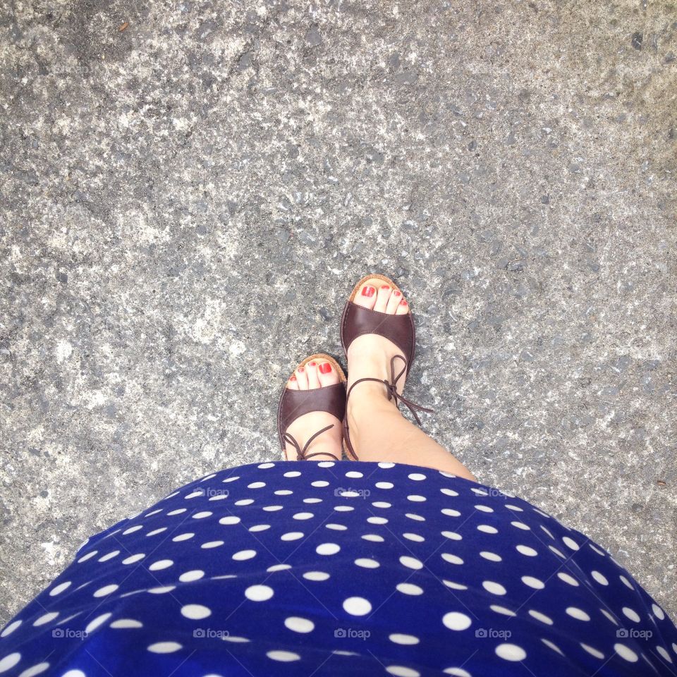 View of sandals. View of a woman's sandals and feet