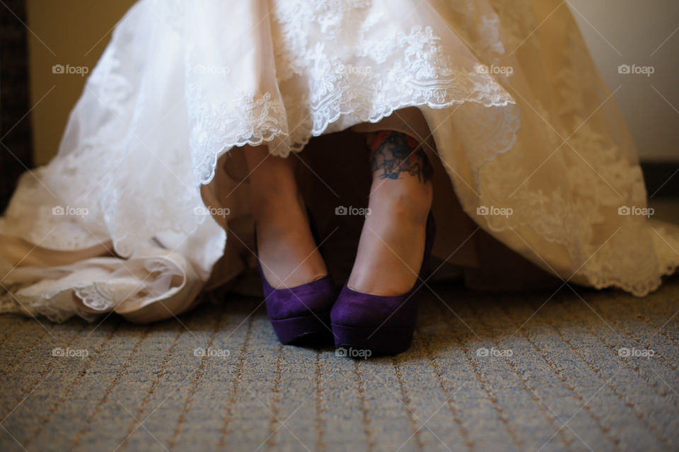 Bride with Tattoo Waiting in Wedding Dress Wearing Purple Shoes - Elegant Violet Heels Showcased by Lace 
