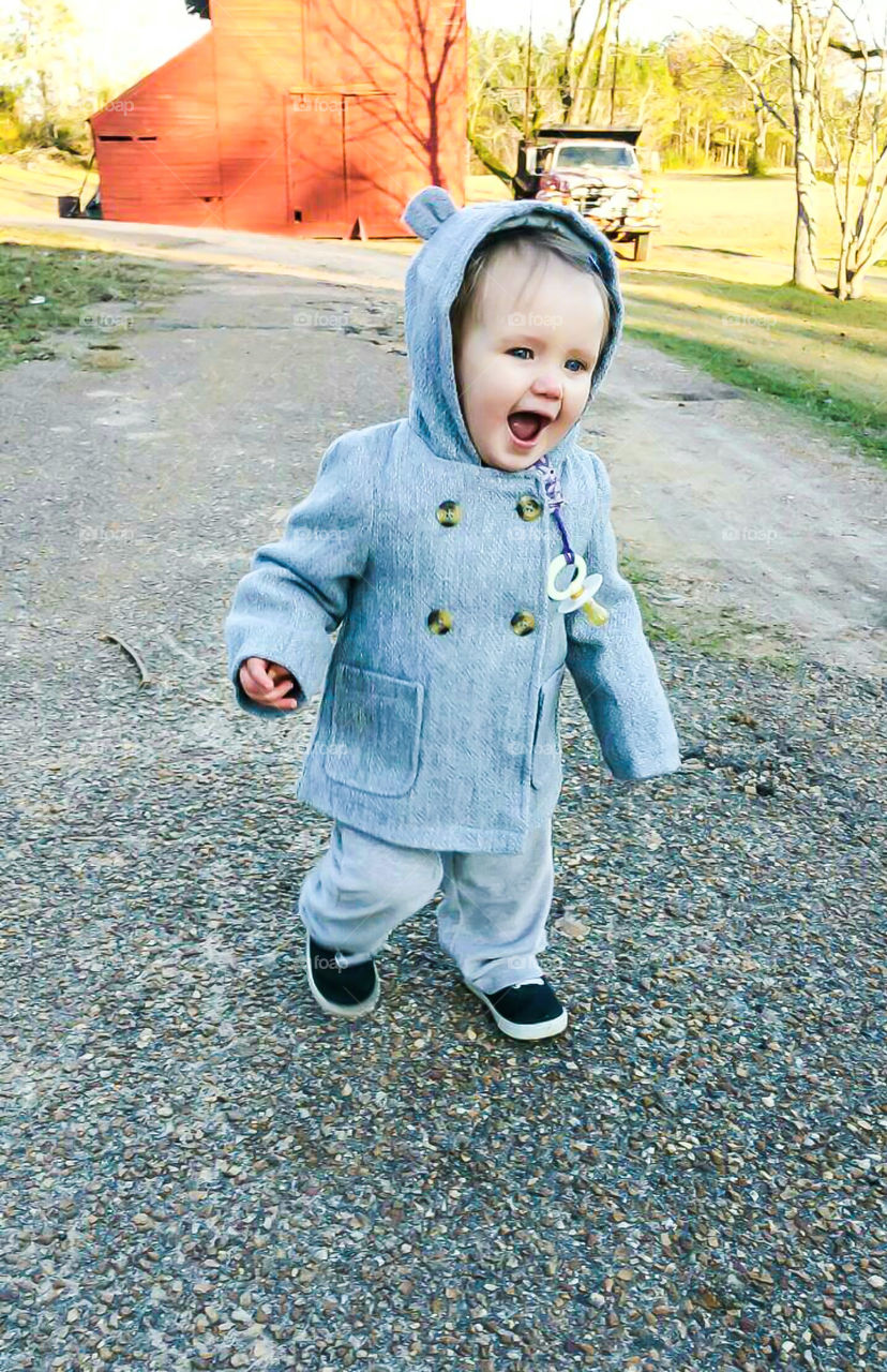 little girl outside playing