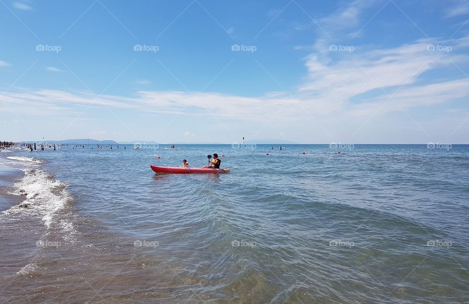 Canoe boat on the Mediterranean Sea in Tuscany
