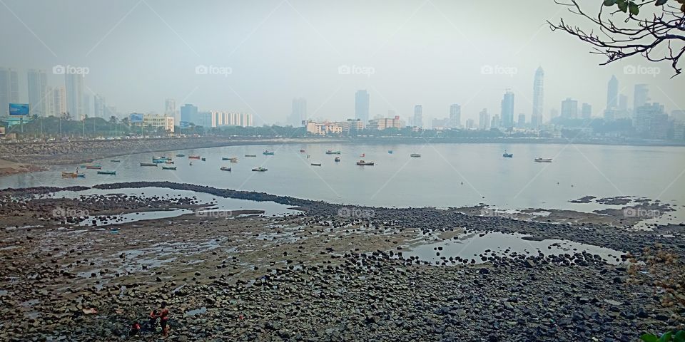 #seashore#hajialiarea#noperson#city#water#buildings#boats#cityview#