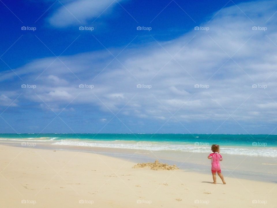 Young girl on a tropical beach