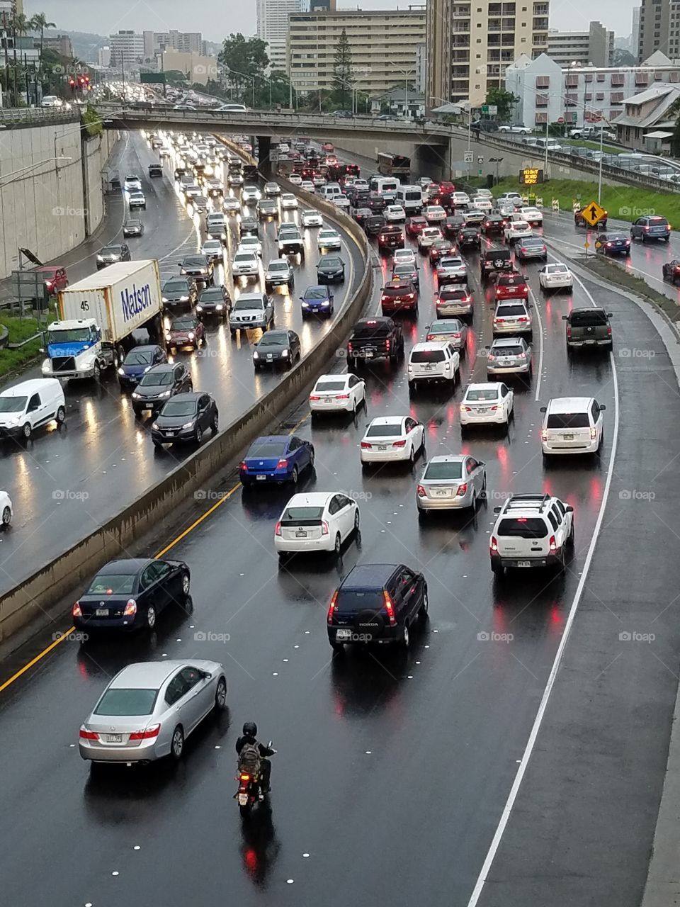 rain-soaked rush hour freeway traffic