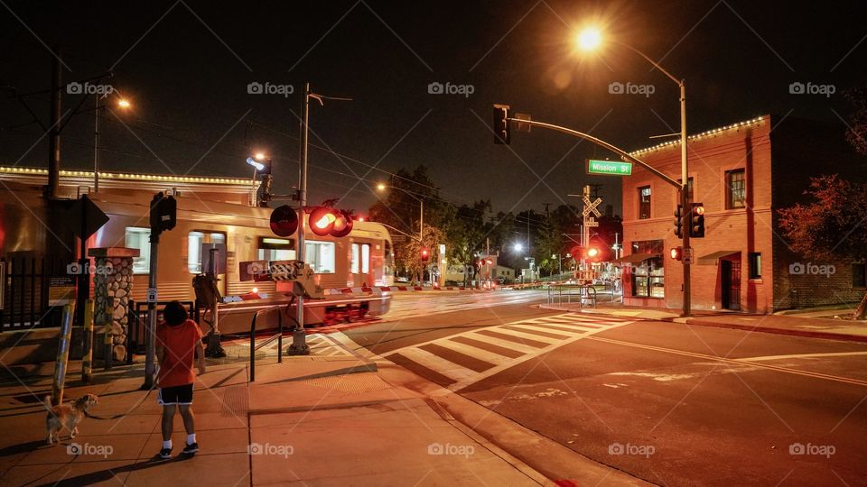 Train crossing at night