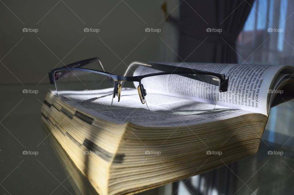 Book and eyeglasses 