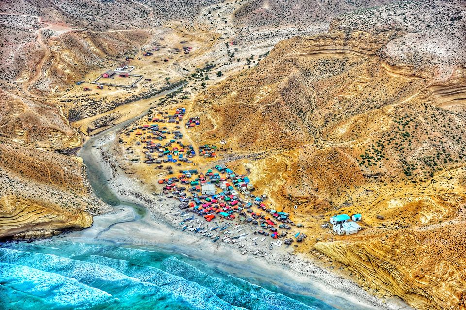 Aerial view from a helicopter as we pass over one of the many fishing villages on the coast of Somalia Africa
