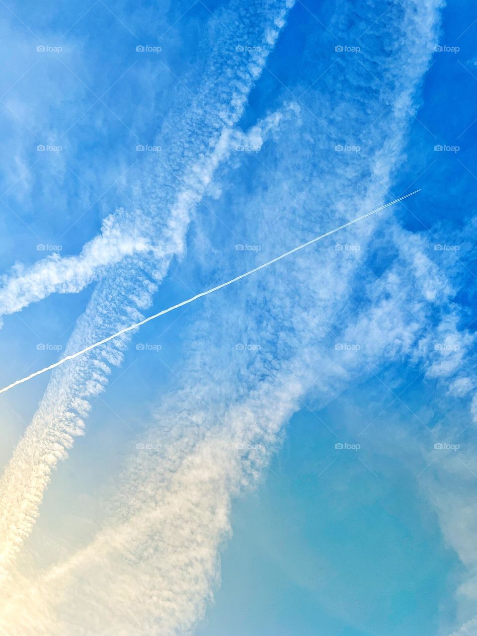 Busy sky full of contrails 