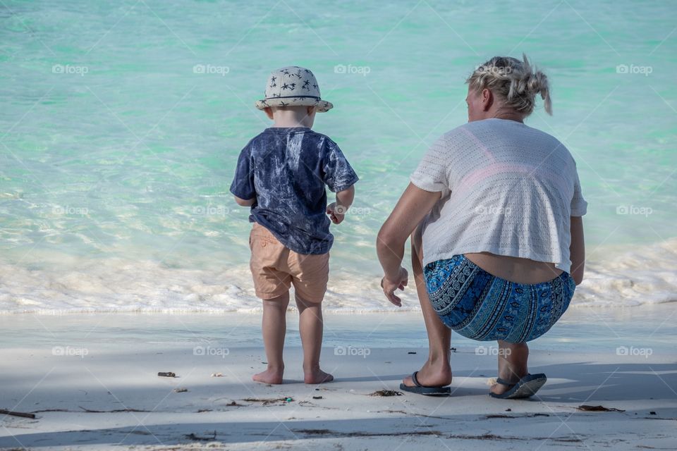 Kid and Mom take their vacation on beautiful beach .. koh lipe thailand