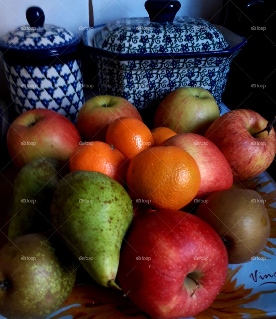 fruits  and  white- blue containers in the kitchen