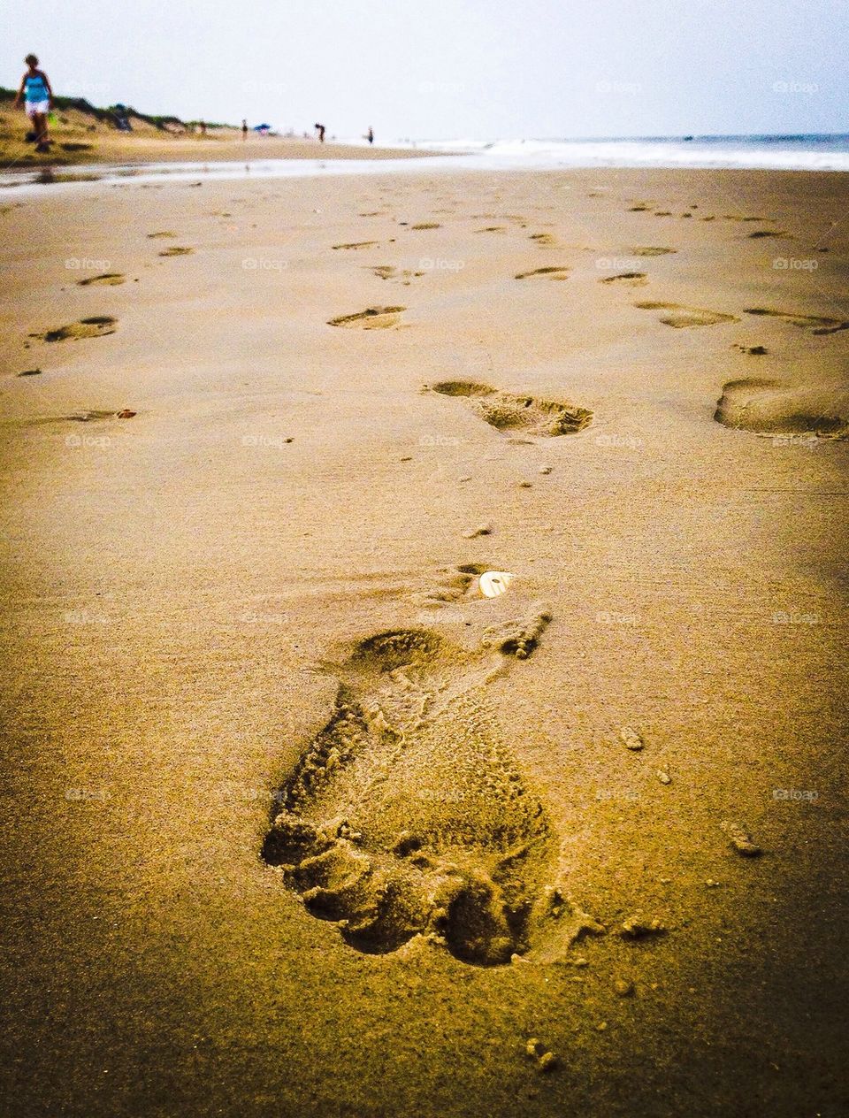 Footprint on sand at beach