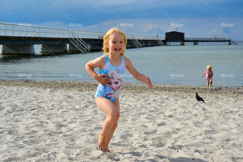 Young girls playing on the beach Ribban in Malmö Sweden.