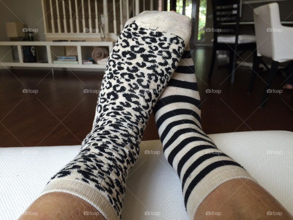 Mismatched socks, leopard print and stripes