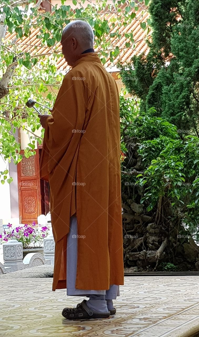 Buddhist monk, praying, da lat temple.