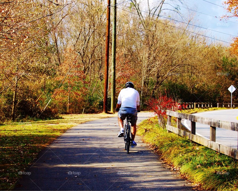 Man Riding Bike On a Fall Day