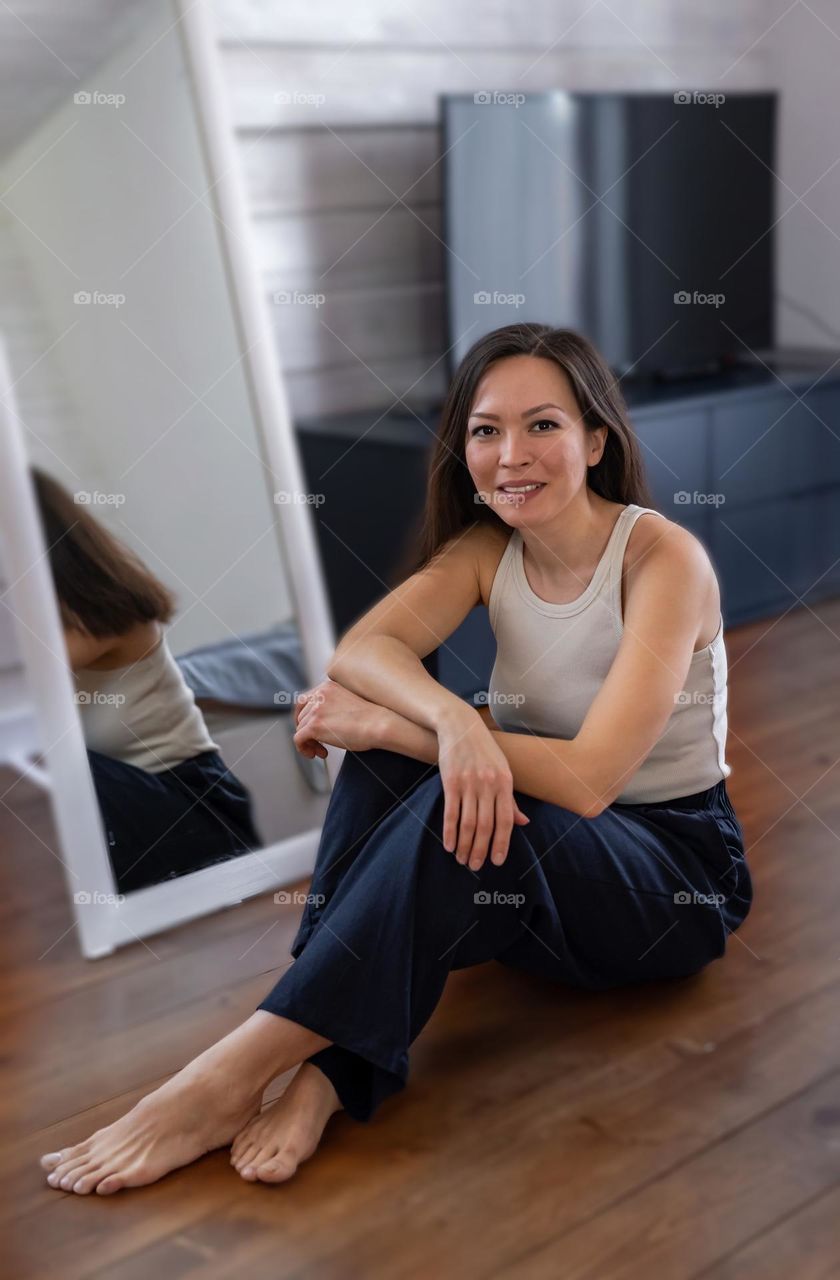 beauty salon young woman sitting in front of a mirror