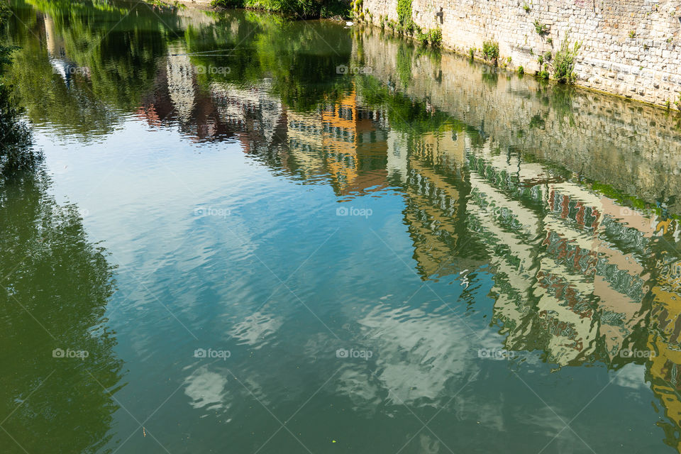 reflection of houses in a river