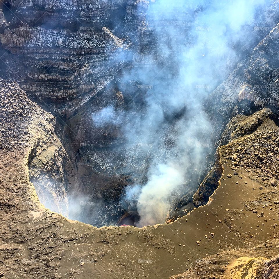 Active volcano expelling vapors.