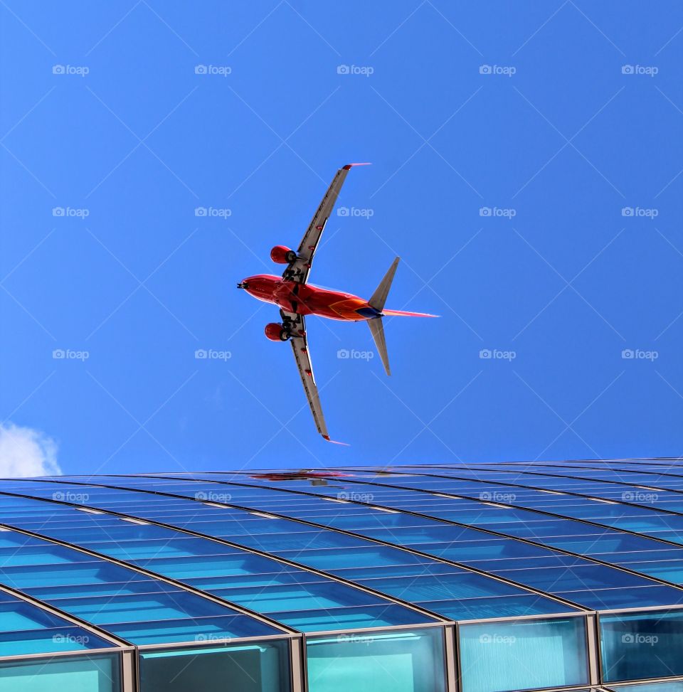 airplane architectural building, airplane coming in for a landing