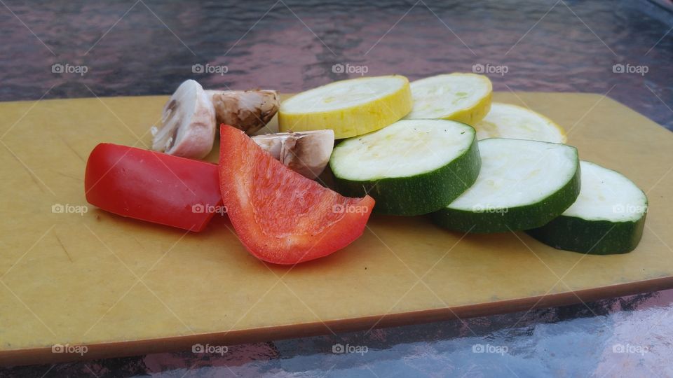 red bell peppers cucumbers mushrooms in yellow squash