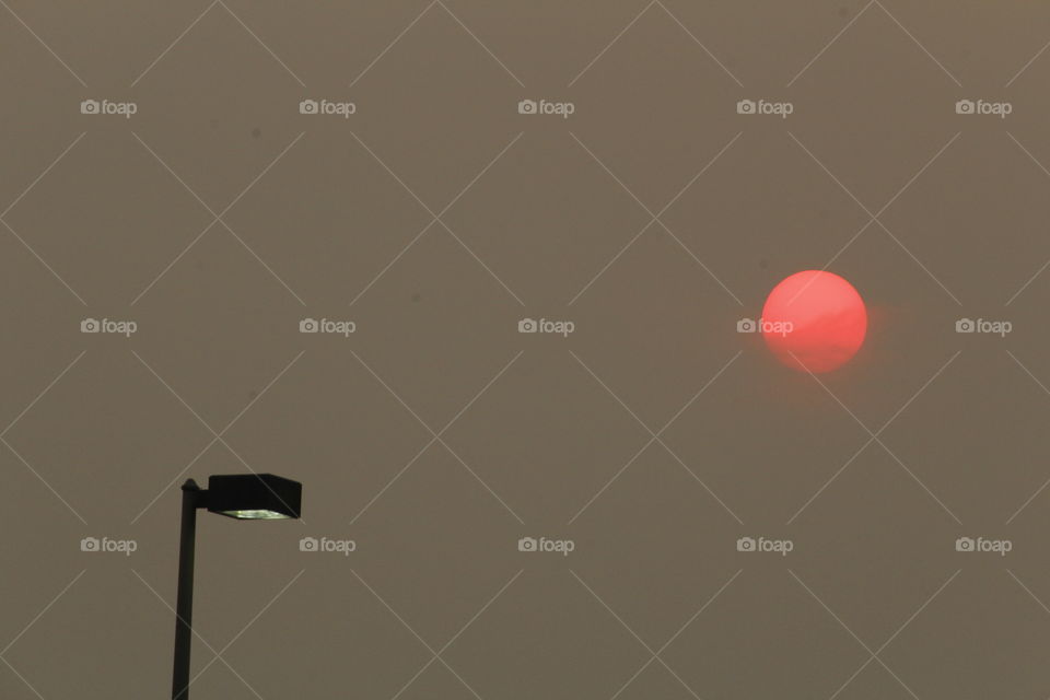red sun light pole