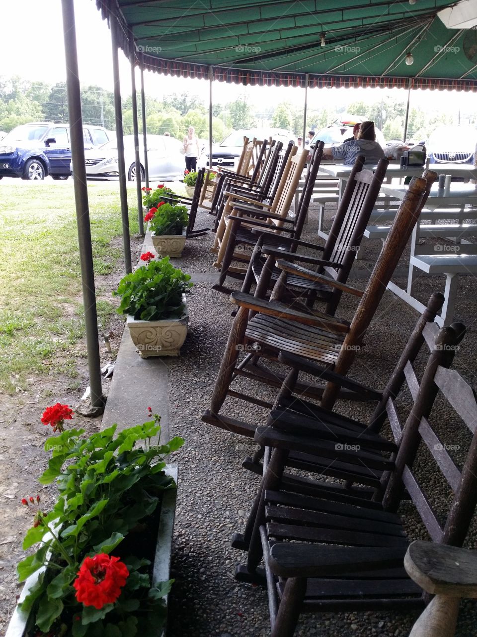 Rocking chairs on the porch of this very popular produce stand/barbecue restaurant/ice cream parlor invite family and friends to sit and visit for a spell,