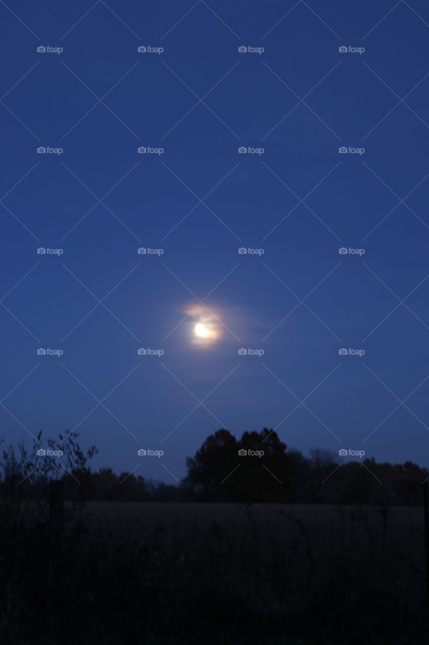 Moonrise over the countryside.