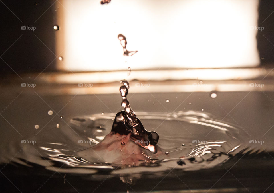 A drop of human blood flows into the water.