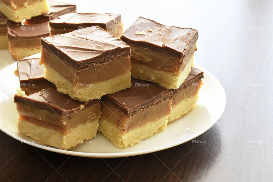 Millionaire's shortbread, caramel shortcake, or millionaire's slice. Copy space is on the right side.
