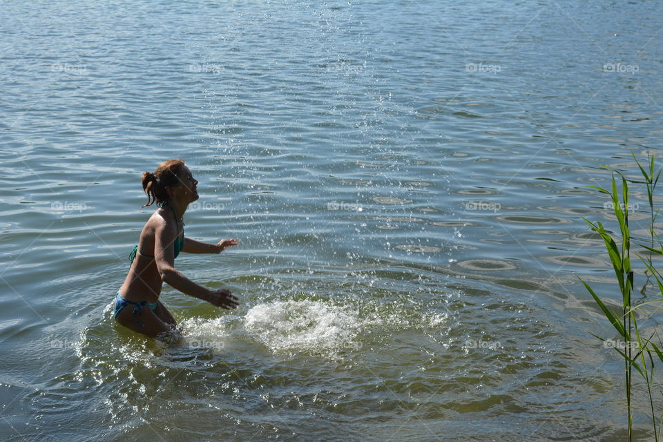 woman in the water lake summer heat, summer vacation