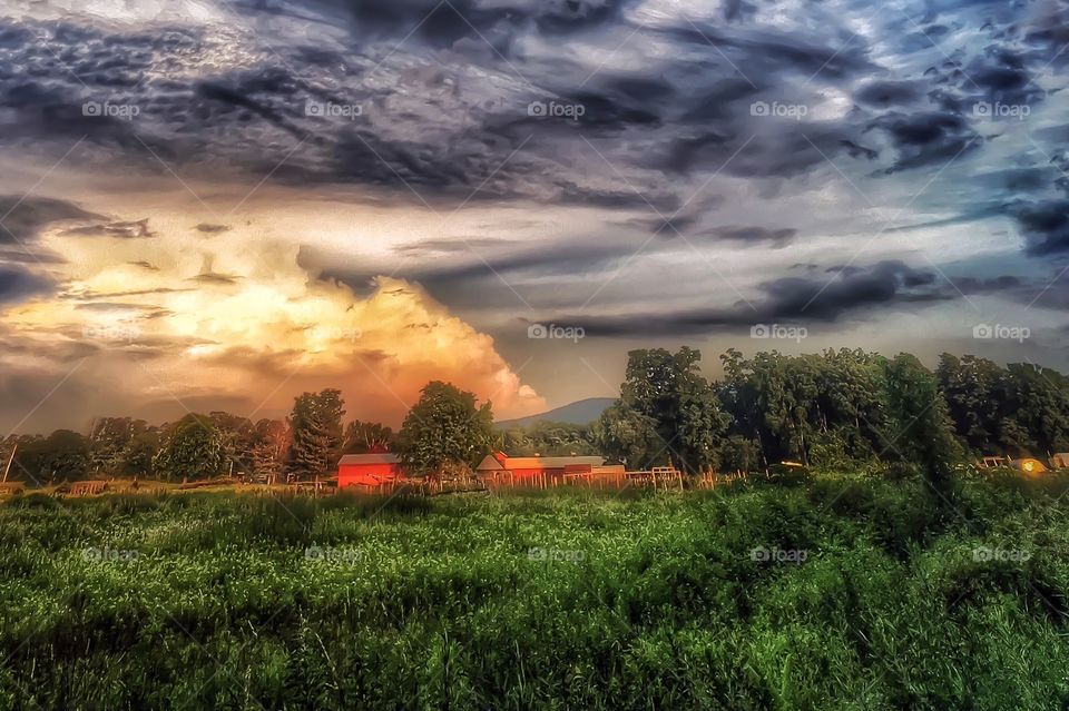 Bizarre clouds and nature. A bizarre cloud formation moves along the valley. 