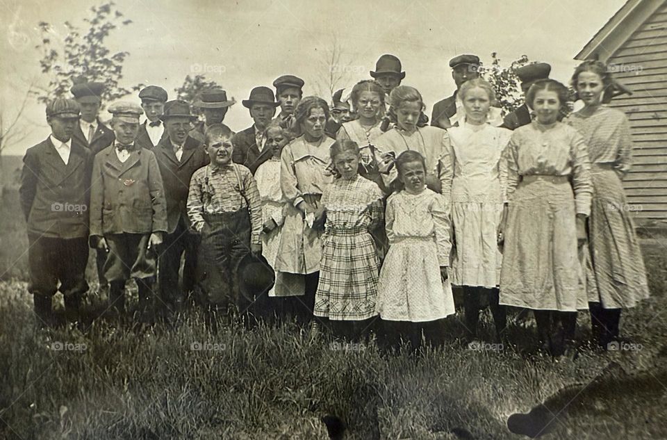 Early 1900s children in front of school house