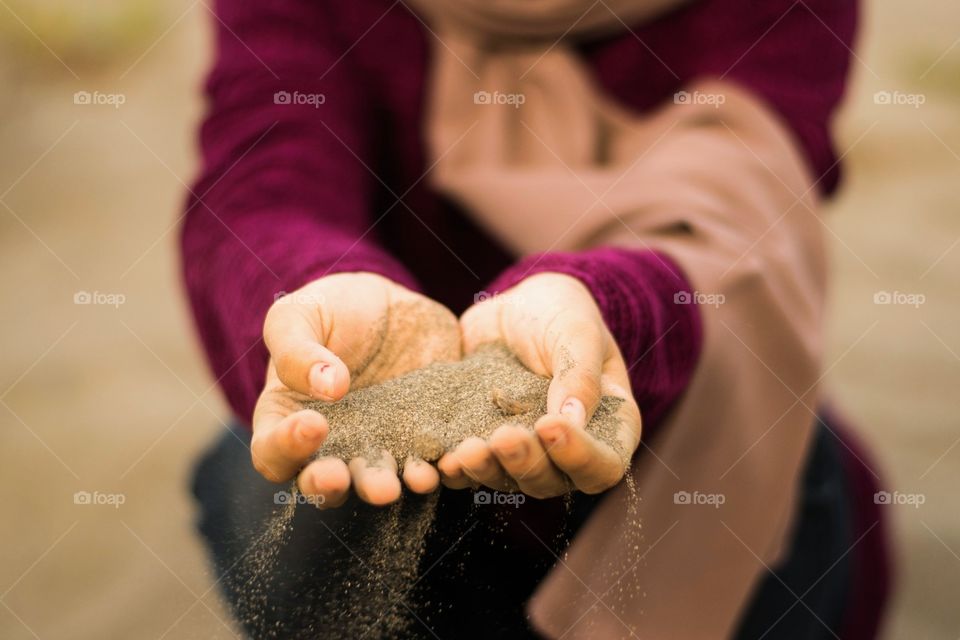grasp of sand