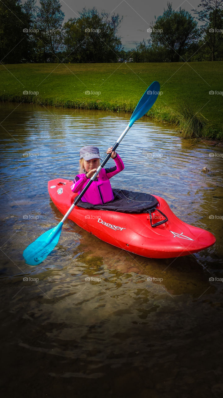 Small girl kayaking.