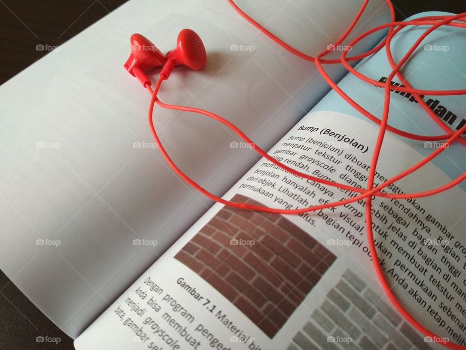 Open book and earphones