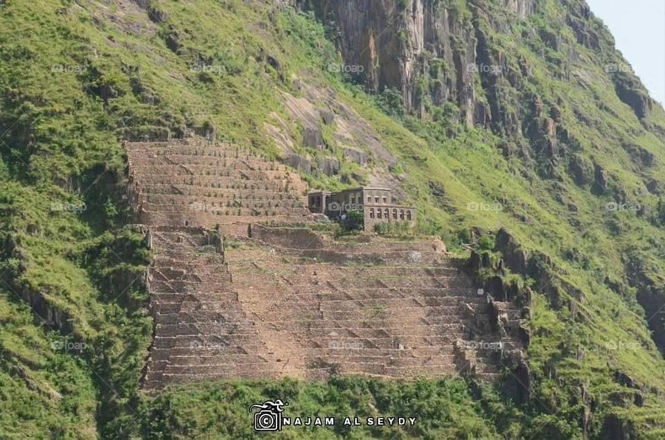 A stunning view of green mountains covered in fog in Yemen