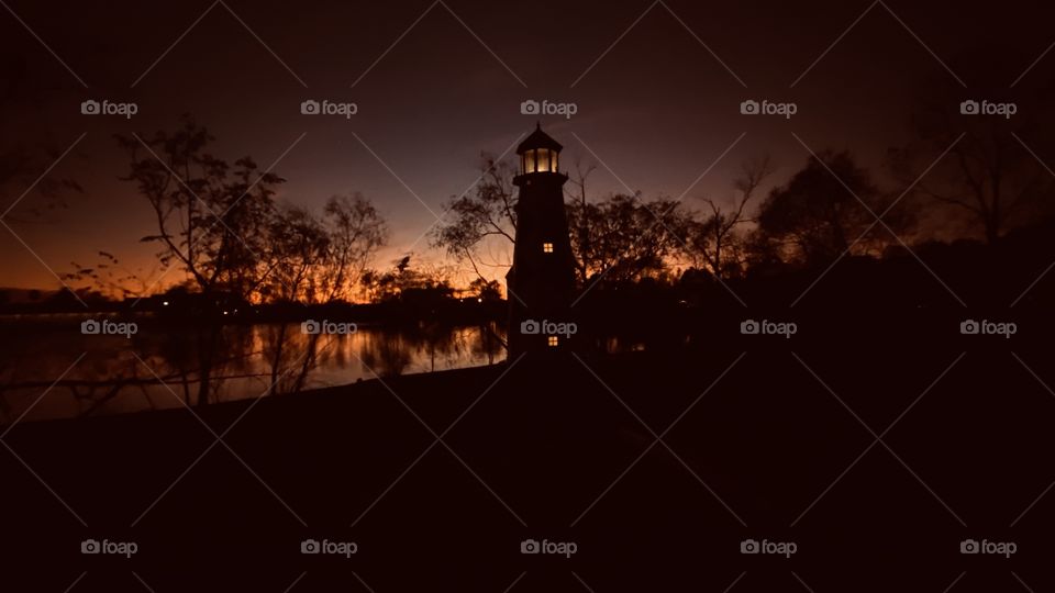 Adding a little more Light. The Majestic LightHouse is lit for the Evening. The Backlit Western Shore is Squeezing out whatever light is to make Very Beautiful Evening Pose.