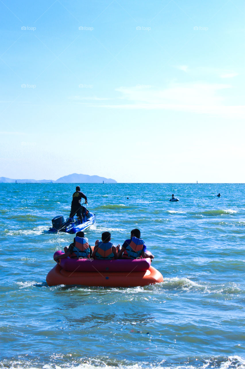 People travel at the sea to relax, swim in the summer.