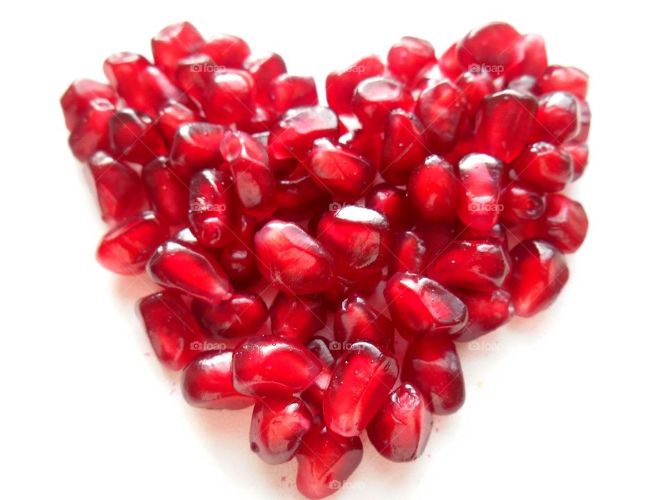 Pomegranate seeds forming heart shape