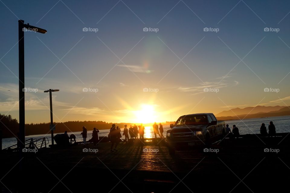 Watching a glorious sunset on holiday ... love the silhouette of the people and how the sunrays light up the pier 💜